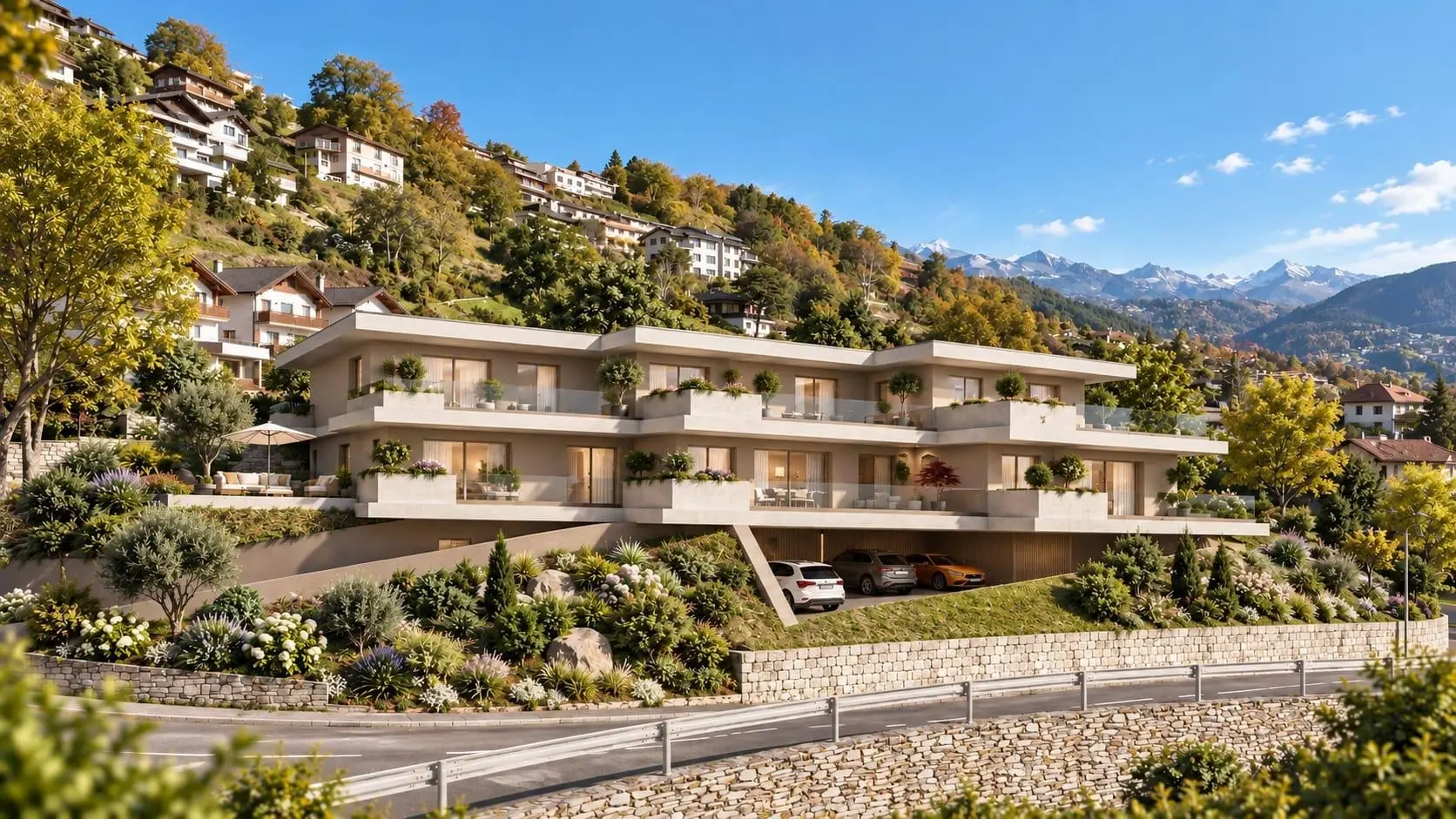 Les Terrasses à Willy vues depuis la route, façades claires en gradins, terrasses plantées plein sud, coteau de Savièse et Alpes en arrière-plan